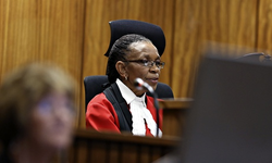 Judge Masipa delivers her judgment in the Oscar Pistorius murder trial. Image Source: Reuters.