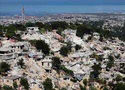 Port-au-Prince the day after the earthquake (REUTERS/Eduardo Munoz)