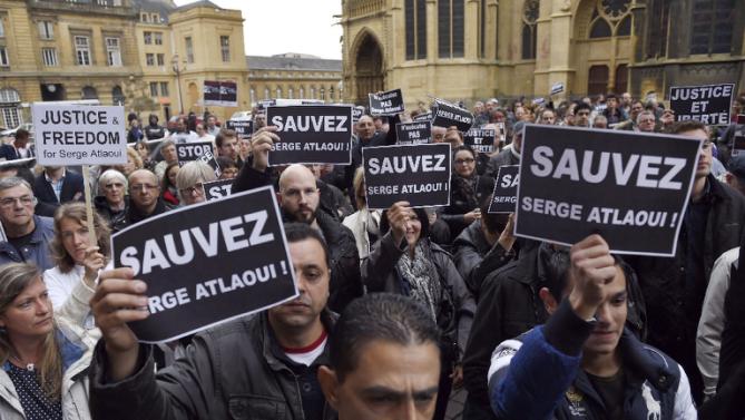 Protesters hold signs reading “Save Serge Atlaoui” at a rally in eastern France Saturday. (AFP Poto/Alexandre Marchi) http://news.yahoo.com/photos/protesters-hold-signs-reading-save-serge-atlaoui-april-photo-211646816.html