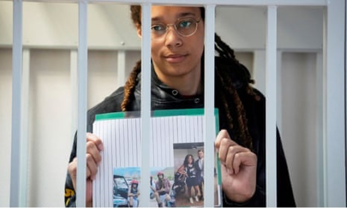 Image from: The Guardian, https://www.theguardian.com/sport/2022/jul/28/brittney-griner-photos-court-russia-drugs-trial-wife-basketball