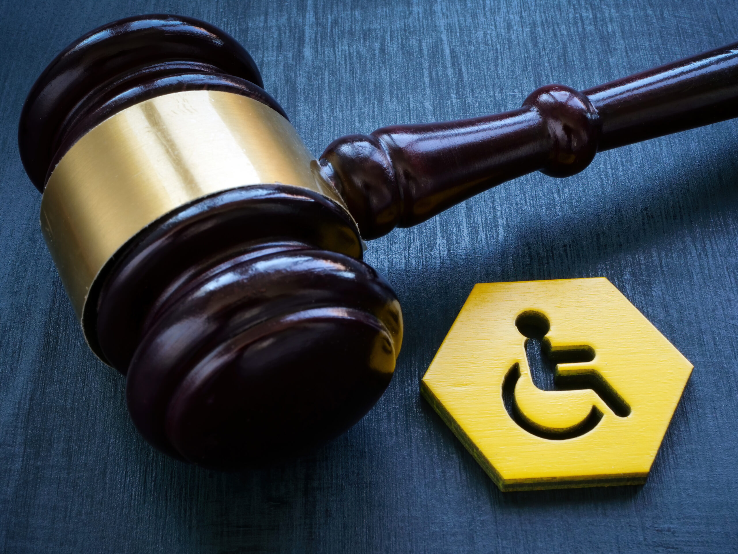 https://www.istockphoto.com/photo/gavel-as-symbol-of-law-and-disability-person-sign-gm1494494355-517806579